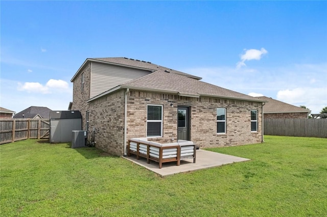 4424 Cornwall St, Springdale, AR 72762 - rear view of house with a fenced backyard, a patio, brick siding, and roof with shingles