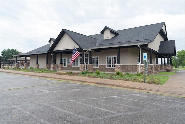 4424 Cornwall St, Springdale, AR 72762 - view of front facade with stone siding, stucco siding, and a shingled roof