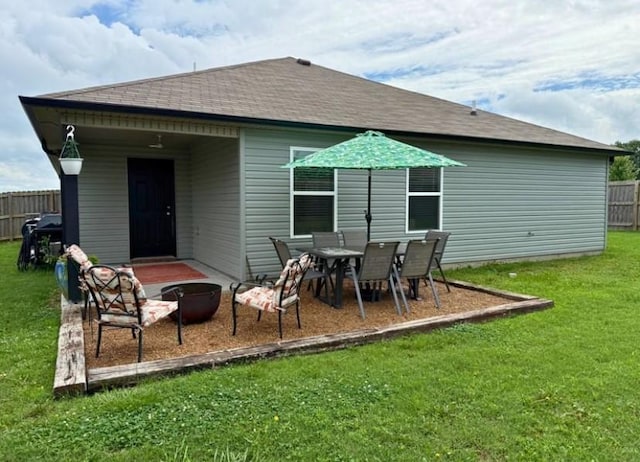 808 NW 69th Ave, Bentonville, AR 72713 - back of property featuring roof with shingles and a fire pit