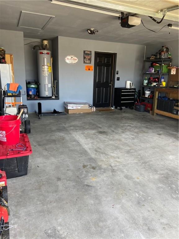 808 NW 69th Ave, Bentonville, AR 72713 - garage featuring water heater and a garage door opener