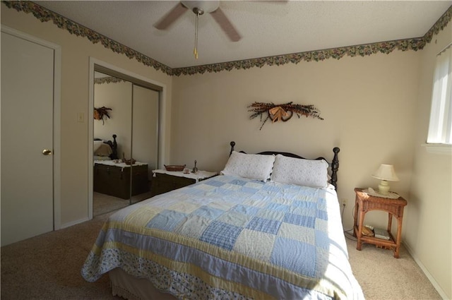 8096 Magnolia Ln, Rogers, AR 72756 - bedroom featuring carpet flooring, a closet, and a ceiling fan
