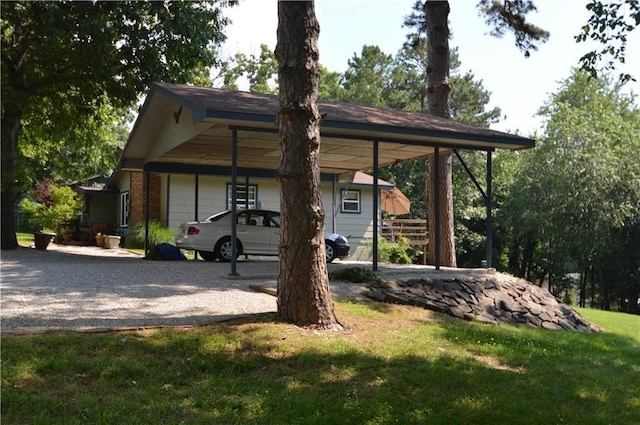 8096 Magnolia Ln, Rogers, AR 72756 - view of parking / parking lot featuring gravel driveway and a carport