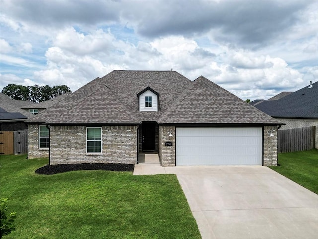 2756 Cassidy Ave, Springdale, AR 72764 - view of front of home with a shingled roof, an attached garage, brick siding, and driveway