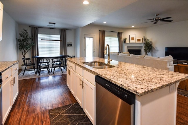 2756 Cassidy Ave, Springdale, AR 72764 - kitchen with stainless steel dishwasher, white cabinets, dark wood-type flooring, light stone countertops, and a ceiling fan