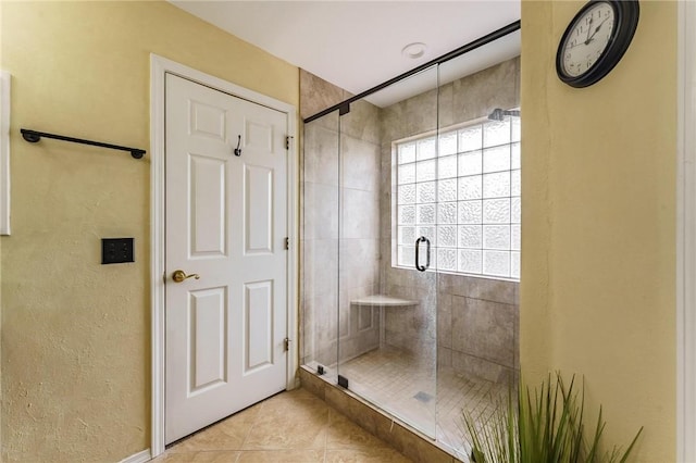 4 Skelton Dr, Bella Vista, AR 72715 - full bathroom with tile patterned flooring, a shower stall, and a textured wall