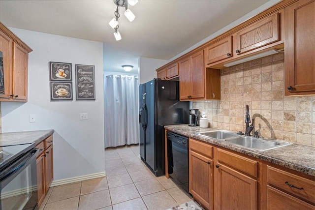 3405 SW Picasso Blvd, Bentonville, AR 72712 - kitchen with black appliances, light tile patterned flooring, brown cabinetry, and decorative backsplash