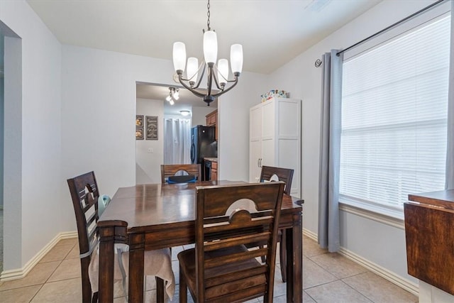 3405 SW Picasso Blvd, Bentonville, AR 72712 - dining area featuring light tile patterned floors and a chandelier