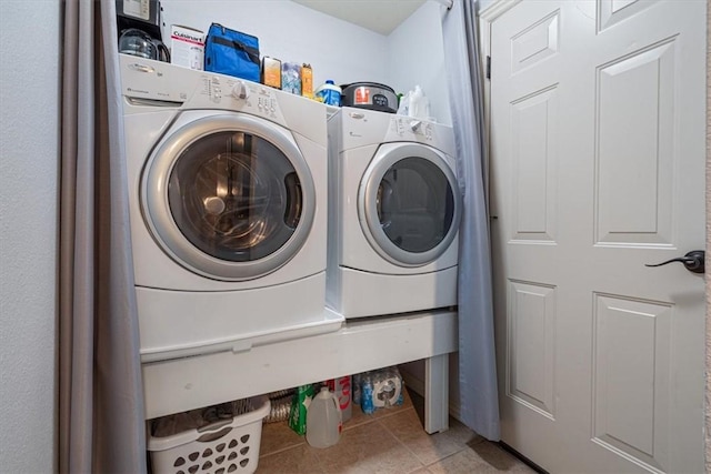 3405 SW Picasso Blvd, Bentonville, AR 72712 - washroom with tile patterned flooring and independent washer and dryer