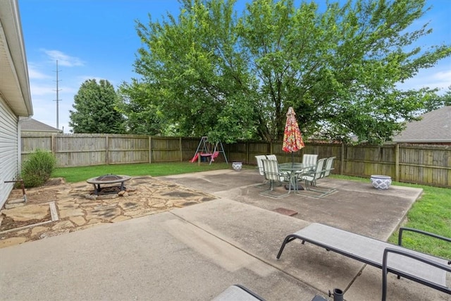 3405 SW Picasso Blvd, Bentonville, AR 72712 - fenced backyard with an outdoor fire pit, a patio, and outdoor dining area