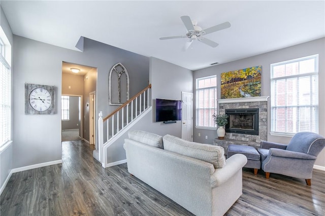 6682 Firefly Catch Ave, Springdale, AR 72762 - living area with stairway, dark wood finished floors, a fireplace, and ceiling fan