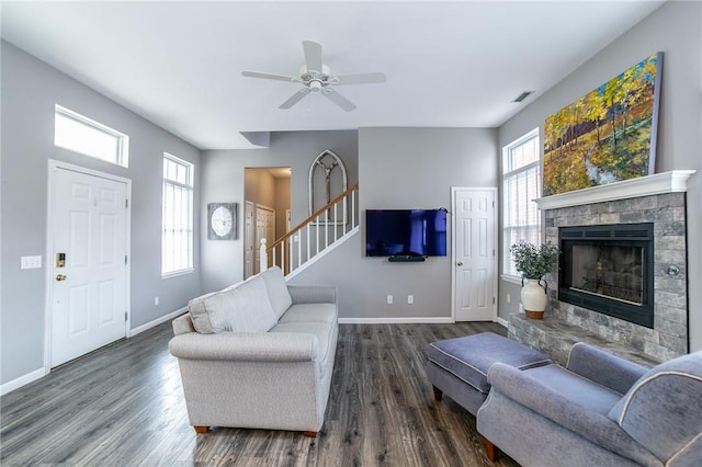 6682 Firefly Catch Ave, Springdale, AR 72762 - living area featuring dark wood-style flooring, plenty of natural light, a fireplace, and a ceiling fan