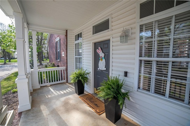 6682 Firefly Catch Ave, Springdale, AR 72762 - view of exterior entry with a porch