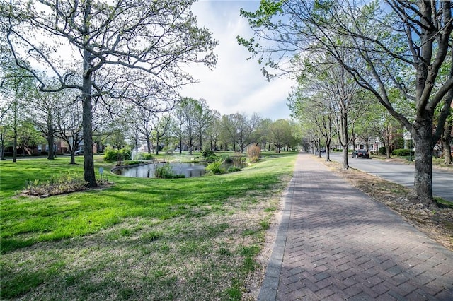 6682 Firefly Catch Ave, Springdale, AR 72762 - surrounding community with a yard and a water view