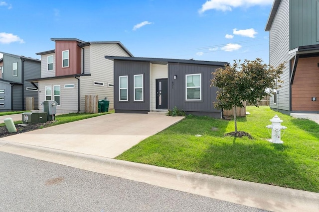 671 St Charles Pl, Bentonville, AR 72713 - view of front of house with a front yard and concrete driveway