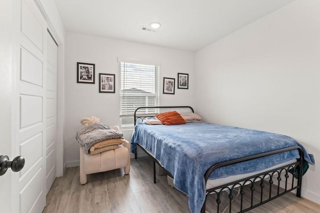 671 St Charles Pl, Bentonville, AR 72713 - bedroom with wood finished floors and baseboards