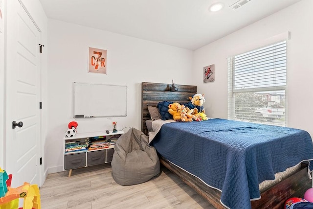 671 St Charles Pl, Bentonville, AR 72713 - bedroom with light wood-style floors and recessed lighting