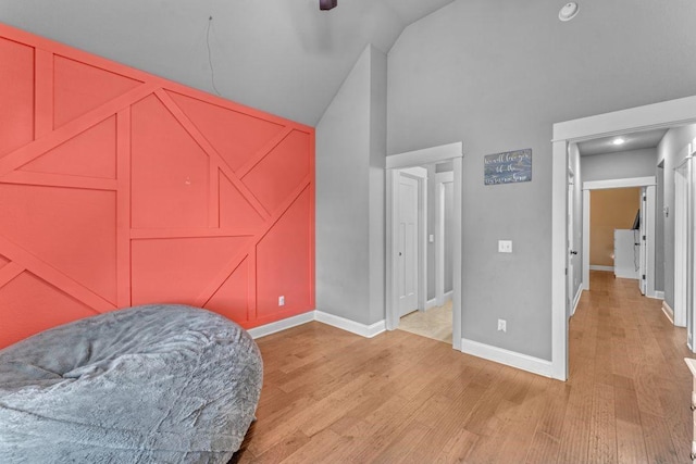 1315 W Magnolia St, Rogers, AR 72758 - bedroom featuring light wood finished floors and high vaulted ceiling