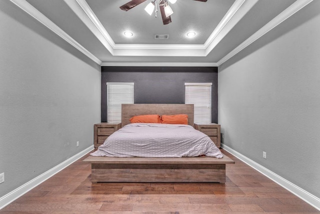 1315 W Magnolia St, Rogers, AR 72758 - bedroom with a tray ceiling, wood finished floors, ornamental molding, ceiling fan, and recessed lighting