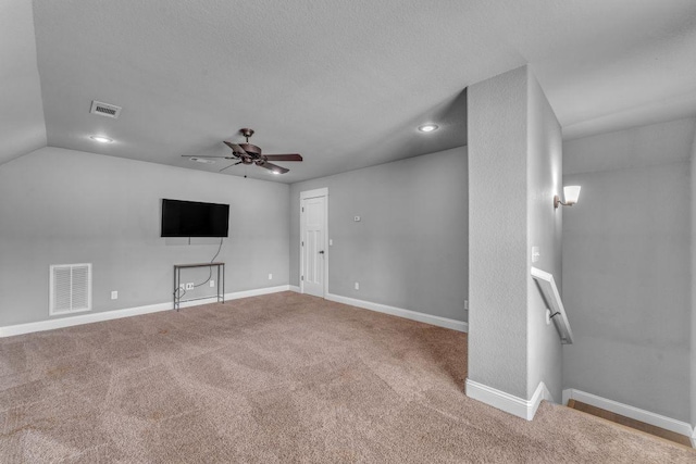 1315 W Magnolia St, Rogers, AR 72758 - unfurnished living room featuring ceiling fan, recessed lighting, carpet floors, and vaulted ceiling