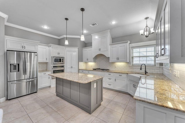 1315 W Magnolia St, Rogers, AR 72758 - kitchen featuring stainless steel appliances, tasteful backsplash, white cabinets, a chandelier, and recessed lighting
