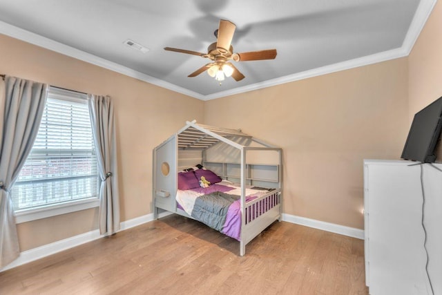 1315 W Magnolia St, Rogers, AR 72758 - bedroom featuring light wood-type flooring, ornamental molding, and a ceiling fan