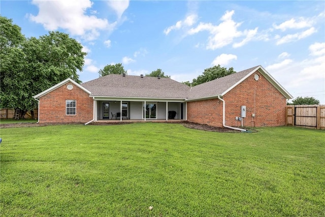 372 Niagara St, Elm Springs, AR 72762 - rear view of property with brick siding and roof with shingles