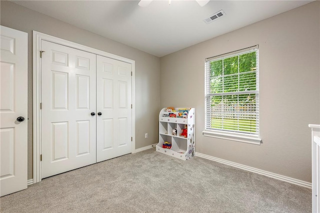372 Niagara St, Elm Springs, AR 72762 - bedroom featuring carpet, a closet, and ceiling fan