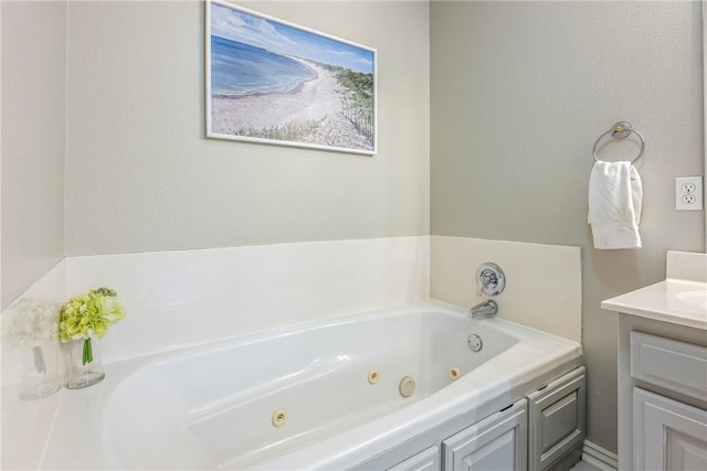 372 Niagara St, Elm Springs, AR 72762 - bathroom with a jetted tub and vanity
