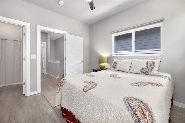 239 N Fletcher Ave, Fayetteville, AR 72701 - bedroom with wood finished floors and ceiling fan