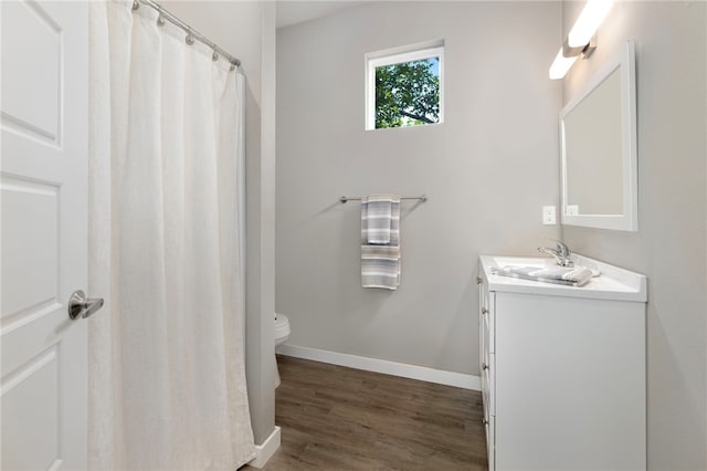 239 N Fletcher Ave, Fayetteville, AR 72701 - bathroom with vanity and wood finished floors