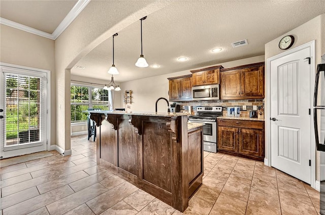 4300 Limestone Ave, Bentonville, AR 72712 - kitchen with appliances with stainless steel finishes, ornamental molding, a breakfast bar, tasteful backsplash, and decorative light fixtures