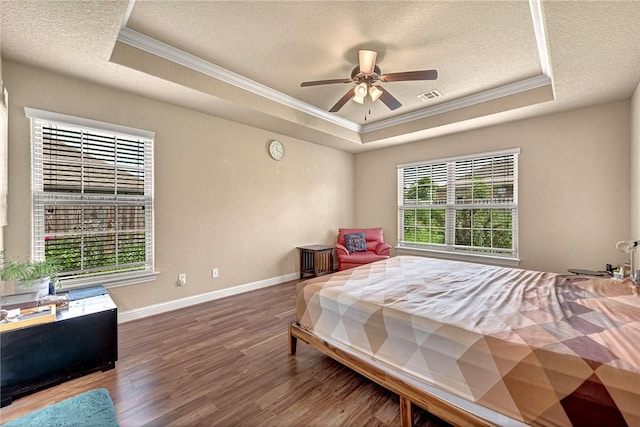 4300 Limestone Ave, Bentonville, AR 72712 - bedroom featuring a tray ceiling, crown molding, a textured ceiling, and wood finished floors