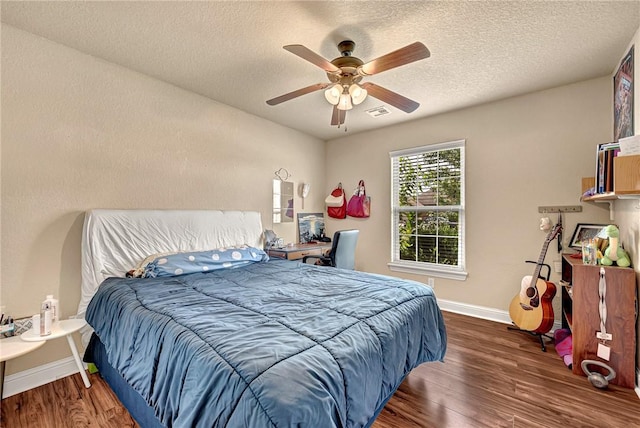 4300 Limestone Ave, Bentonville, AR 72712 - bedroom featuring wood finished floors, a textured ceiling, and ceiling fan
