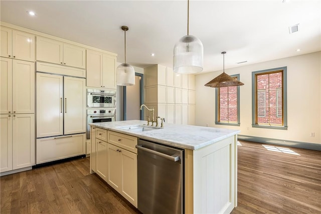 302 NW 5th St, Bentonville, AR 72712 - kitchen with dishwasher, paneled built in refrigerator, dark wood-type flooring, pendant lighting, and recessed lighting