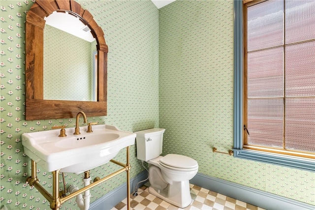 302 NW 5th St, Bentonville, AR 72712 - bathroom with toilet and tile patterned floors