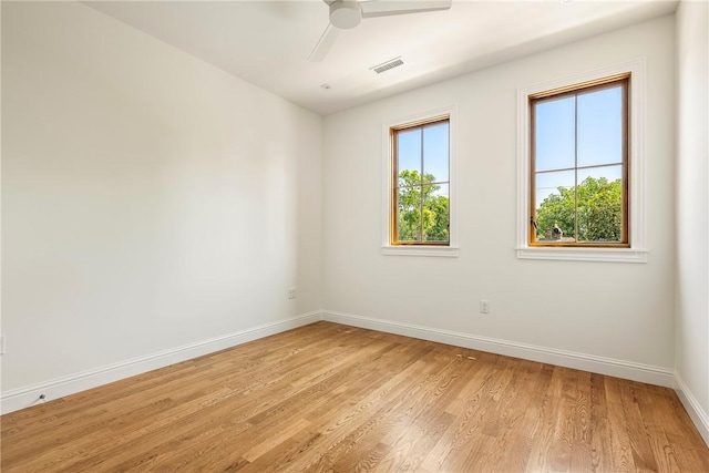 302 NW 5th St, Bentonville, AR 72712 - spare room with light wood-style flooring and ceiling fan