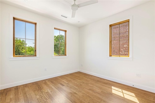 302 NW 5th St, Bentonville, AR 72712 - unfurnished room with wood finished floors and ceiling fan