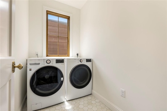 302 NW 5th St, Bentonville, AR 72712 - laundry area featuring washing machine and clothes dryer and light tile patterned floors