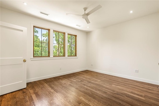 302 NW 5th St, Bentonville, AR 72712 - spare room featuring ceiling fan, wood finished floors, and recessed lighting