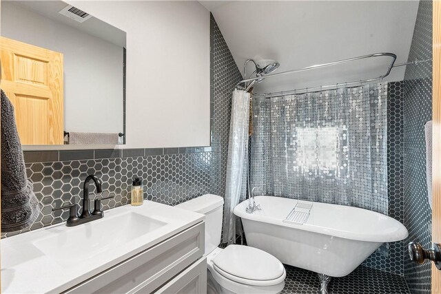 11 Darian Dr, Bentonville, AR 72712 - bathroom with tile walls, tile patterned flooring, and vanity