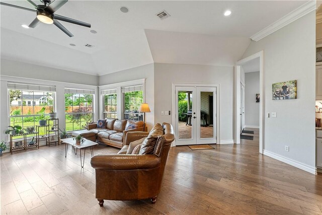 11 Darian Dr, Bentonville, AR 72712 - living area with lofted ceiling, wood finished floors, ceiling fan, french doors, and recessed lighting