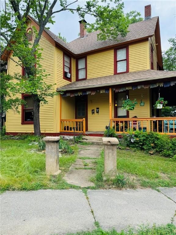 1 Ridgeway Ave, Eureka Springs, AR 72632 - view of front facade with a porch and a chimney