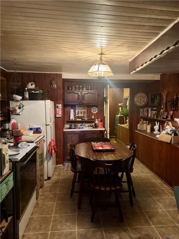1 Ridgeway Ave, Eureka Springs, AR 72632 - dining room with tile patterned flooring, wood walls, and wooden ceiling