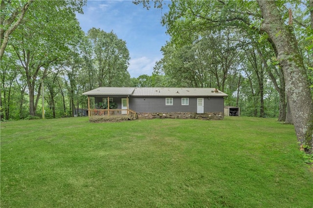 594 Madison 8650, Huntsville, AR 72740 - rear view of property featuring a lawn and a wooden deck