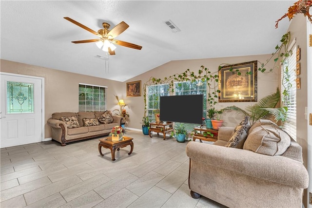 594 Madison 8650, Huntsville, AR 72740 - living room featuring a ceiling fan and vaulted ceiling