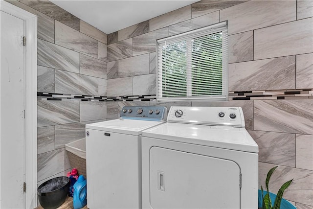 594 Madison 8650, Huntsville, AR 72740 - laundry room with tile walls and washing machine and clothes dryer