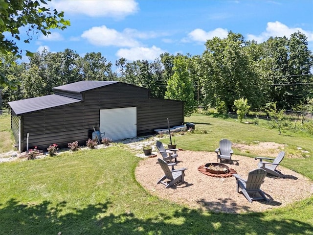 20490 Rocky Branch Rd, Rogers, AR 72756 - view of yard with an outdoor fire pit and an outbuilding