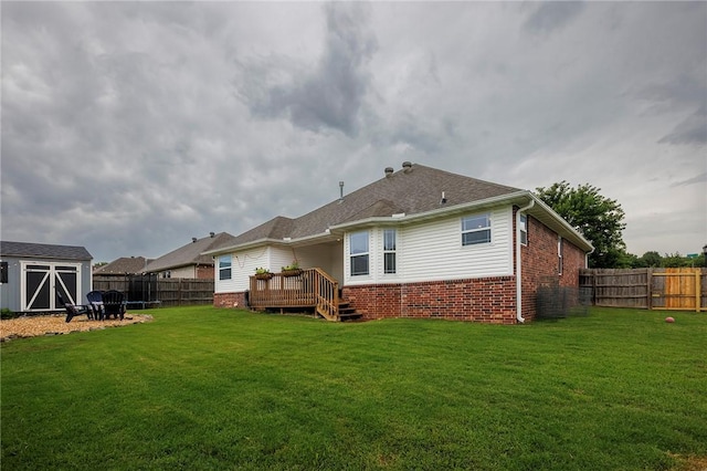 4506 Cory St, Springdale, AR 72762 - rear view of house with a fenced backyard, a shed, brick siding, and a wooden deck