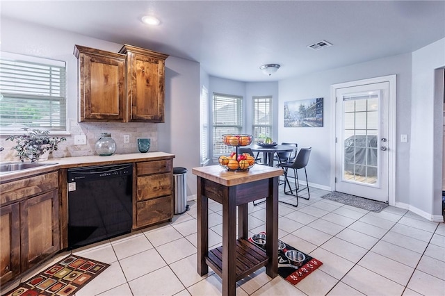 4506 Cory St, Springdale, AR 72762 - kitchen with dishwasher, light countertops, light tile patterned floors, decorative backsplash, and recessed lighting