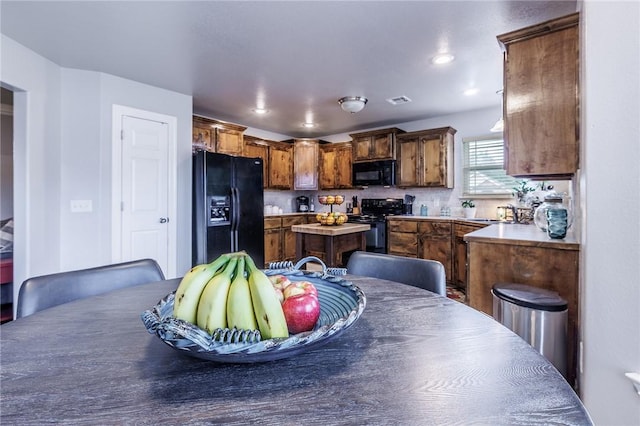 4506 Cory St, Springdale, AR 72762 - kitchen with black appliances, light countertops, and recessed lighting